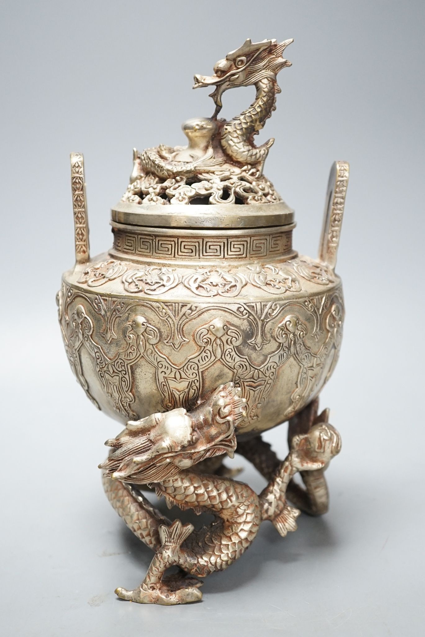 A Chinese bronze 'dragon' censer and cover, 24.5 cms high